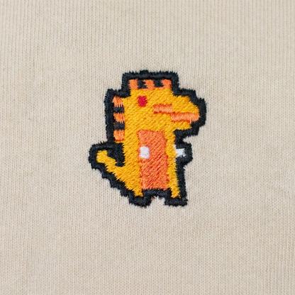 Pixel Dino Orange – Bestickter Bio Hoodie · Beige · Stick-Close-up