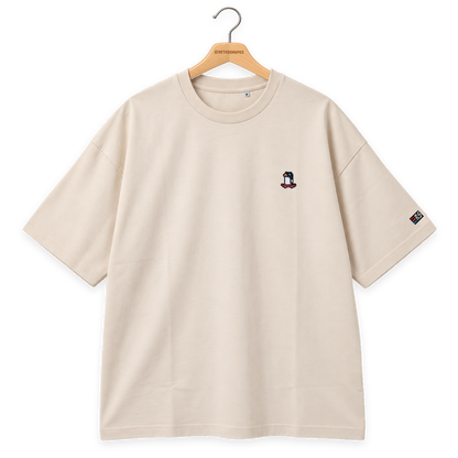 Pixel Pinguin Mit Skateboard – Besticktes Bio Oversized T-Shirt · Beige · Bügel A · Bügel V5