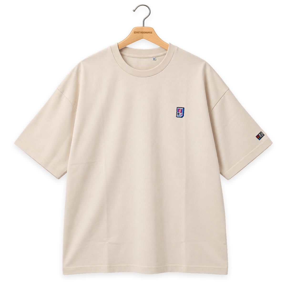 Pixel Handheld – Besticktes Bio Oversized T-Shirt · Beige · Bügel A · Bügel V5