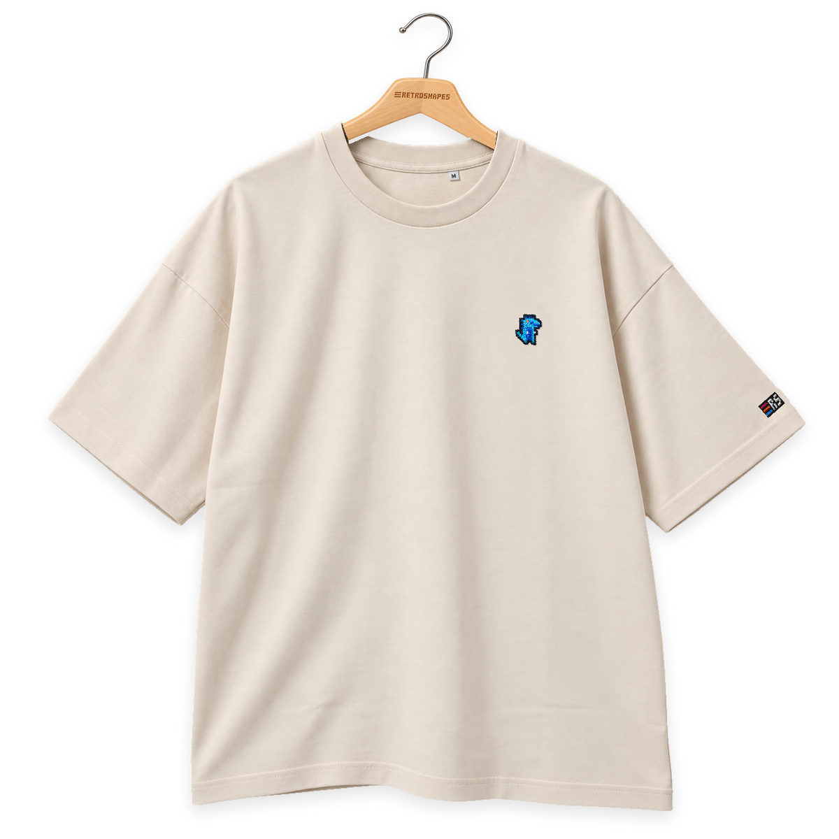 Pixel Dino Blau – Besticktes Bio Oversized T-Shirt · Beige · Bügel B · Bügel V6