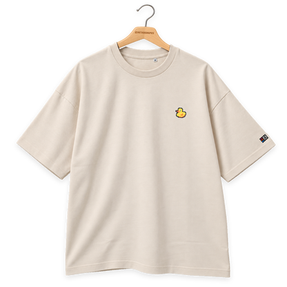 Pixel Ente – Besticktes Bio Oversized T-Shirt · Beige · Bügel B · Bügel V6